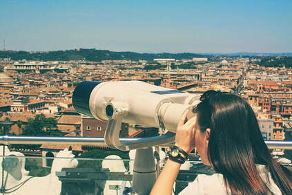 Woman looking through telescope